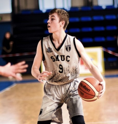 Mathieu playing basketball for SMUC